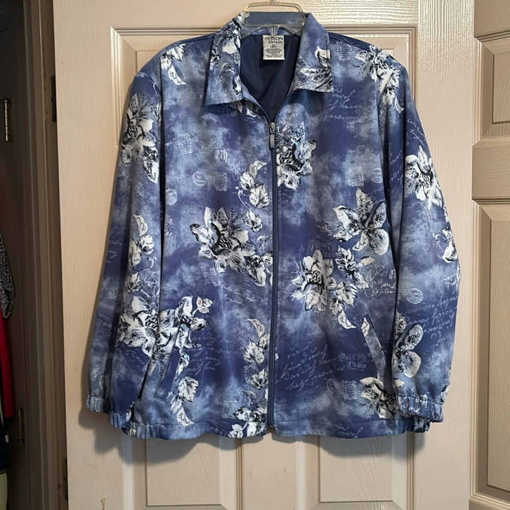 Fall jacket in colors of blue and white with flower designs.